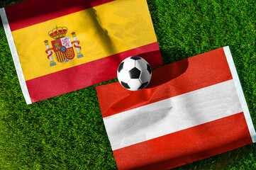 Obraz premium Spain vs Austria, national flags before international football tournament Round of 32 match, football on green grass with goal in the background, Inglewood, California, USA, July 2, 2026