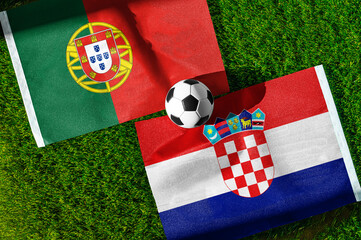 Naklejka premium Portugal vs Croatia, national flags before international football tournament Round of 32 match, football on green grass with goal in the background, Toronto, Ontario, Canada, July 2, 2026