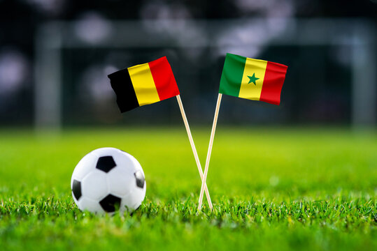 Belgium vs Senegal, national flags before international football tournament Round of 32 match, football on green grass with goal in the background, Seattle, Washington, USA, July 1, 2026