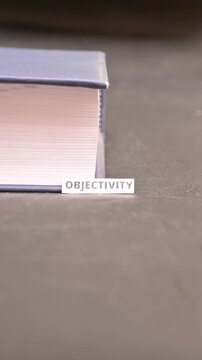 Objectivity Concept on Paper Bookmark Between Books Critical Thinking Video