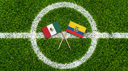 Obraz premium Top Down Aerial View of Mexico and Ecuador Flags on Soccer Field Center Circle