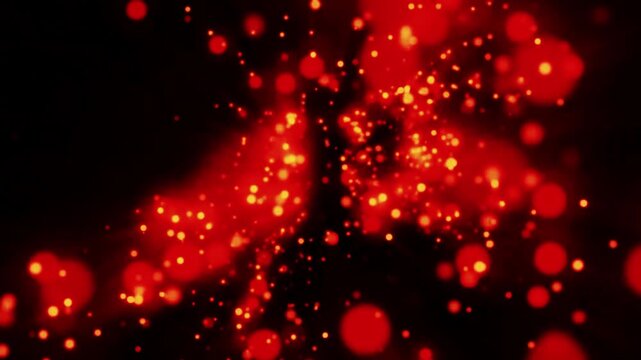 Falling red and yellow sparkling background on dark 4k video