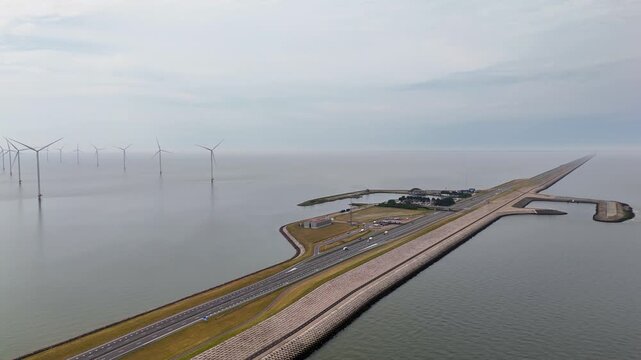 Aerial view of traffic on houtribdijk causeway and offshore wind farm