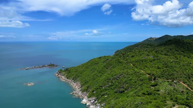 Aerial drone footage capturing the scenic Thong Nai Pan Viewpoint in Koh Phangan, Surat Thani, Thailand. The video reveals lush tropical hills, coastline views, and the surrounding island landscape fr