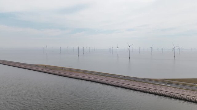 Aerial view of offshore wind farm and afsluitdijk in the netherlands