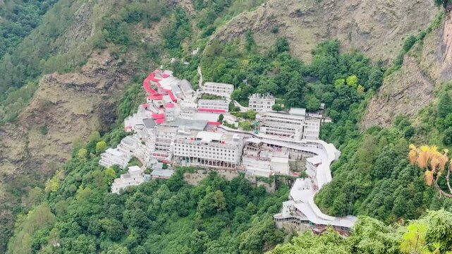 The renowned Vaishno Devi Temple perched in the scenic Himalayas, offering a magnificent blend of spirituality, architecture, and breathtaking mountain landscapes.