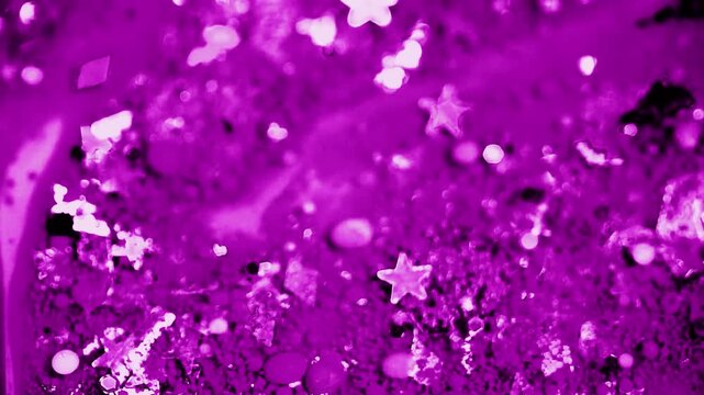 Flowing purple sparkling background on dark 4k video
