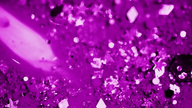 Flowing purple sparkling background on dark 4k video