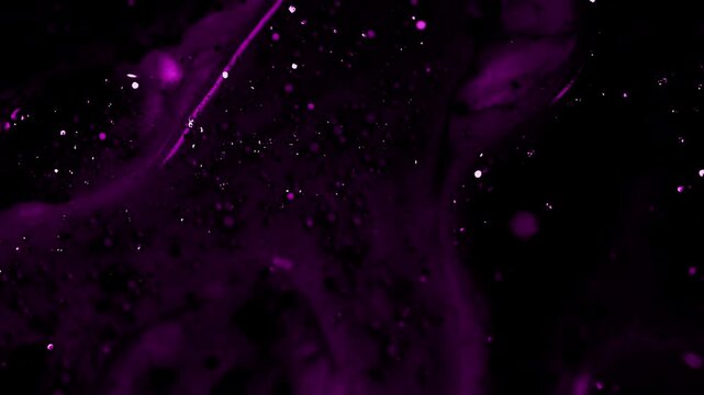 Flowing purple sparkling background on a dark 4k video