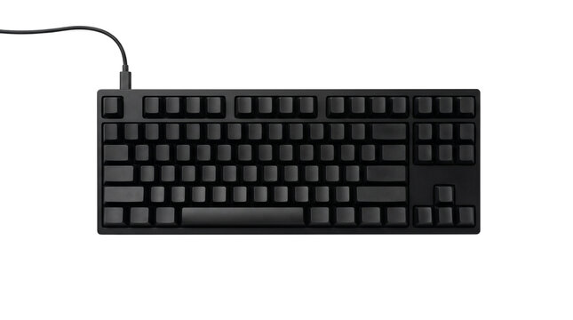 Minimalist black mechanical keyboard with blank keycaps, professional wired computer peripheral, sleek matte gaming hardware for office and coding isolated PNG with Transparent Background