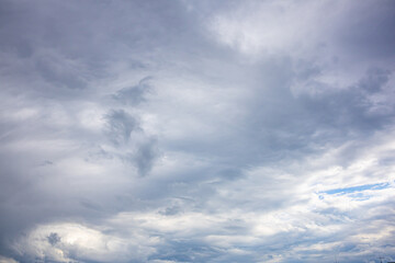 Fototapeta premium Soft Blue Sky with High Thin Clouds and Natural Texture. Light blue sky covered with delicate high-altitude clouds creating a peaceful natural background. Ideal for weather, seasonal, environmental