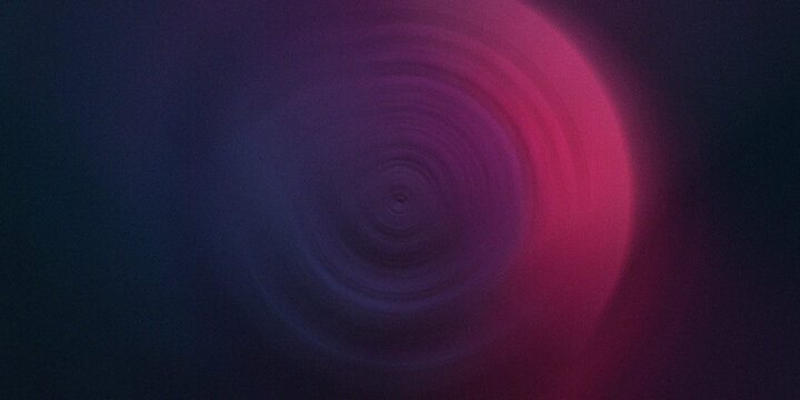 Dark abstract background with fuchsia and purple radial blur and fine grain texture.