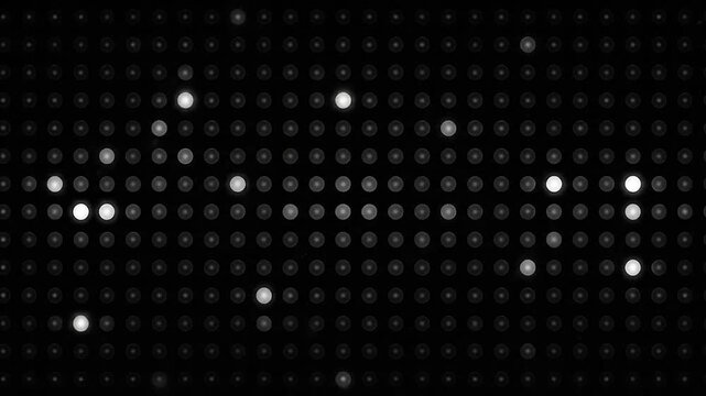 A grid of glowing white LED lights flashing on a dark background