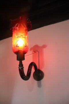 Vintage Wrought Iron Electric Wall Sconce Lantern Glowing Red