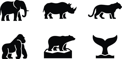 Collection of diverse animal silhouette icons including elephant rhino tiger gorilla polar bear and whale tail for wildlife or conservation concepts © Ali