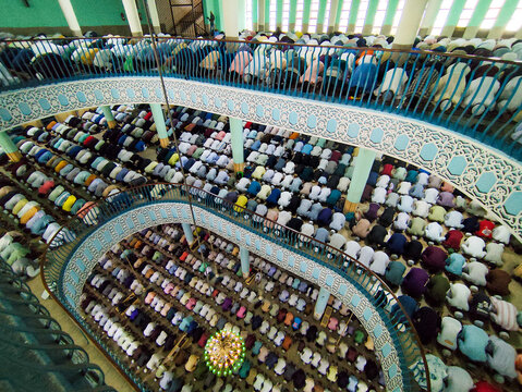 Dhaka, Bangladesh - 26 June 2026: Aerial view of Baitul Mukarram National Mosque with rows of men praying inside the multi-level prayer hall.