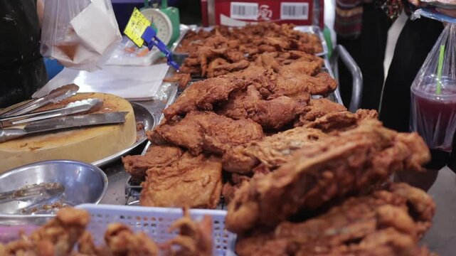 Asian Style Fried Crispy Chicken Displayed for Sale at Local Asian Bangkok Street Food Open Night Market in Thailand
