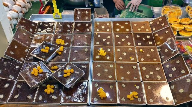 Fresh Baked Thai Custard Taro Dessert (Khanom Mo Kaeng) Being Sold at Asia Street Food Open Market	
