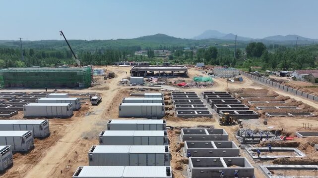 Construction site of energy storage power station with container units and foundation pits layout