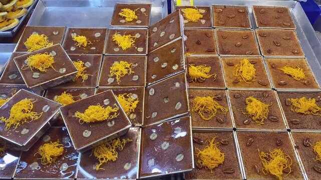 Fresh Baked Thai Custard Taro Dessert (Khanom Mo Kaeng) Being Sold at Asia Street Food Open Market	