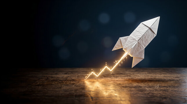 Origami Paper Rocket Launch with Glowing Growth Arrow on Wooden Table Featuring Copy Space for Business Concepts