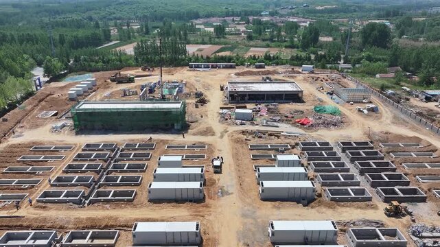 Aerial view of large-scale energy storage power station construction site with battery modules and infrastructure