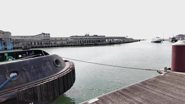 Boulogne-sur-Mer, June 2026 - Hike along the Opal Coast in northern France - View of the harbor and the seawall, with calm waters and a soothing mist