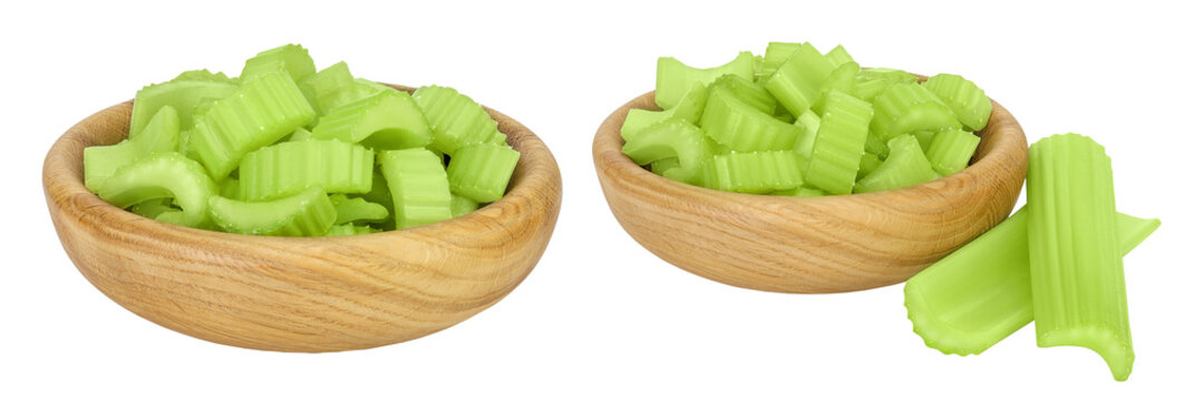 fresh celery in wooden bowl isolated on white background with full depth of field