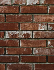 Fototapeta premium Full frame textured background of an old weathered red brick wall