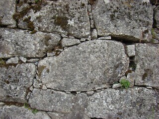 Fototapeta premium Old rough weathered granite stone wall texture background