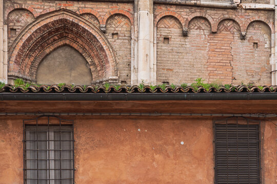 view of the Loggia Dei Mercanti along the south side of the San Giorgio Cathedral inside the Trento e Trieste Square, Ferrara