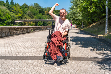 Fototapeta premium Disabled man celebrating victory outdoors in park