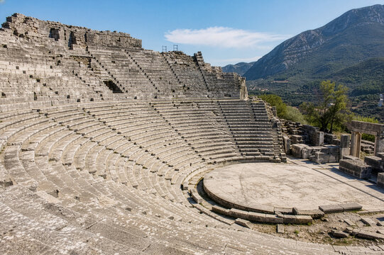 Ancient Theatre of Messene: Magnificent Tiered Stone Amphitheater with Mountain Backdrop in Peloponnese, Greece