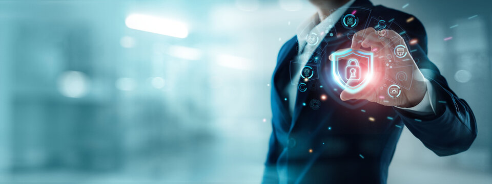 Cyber security and data protection, Abstract, Businessman holding shield and padlock protect Personal data,Business and financial data on network. Technology develop smart solution from digital attack