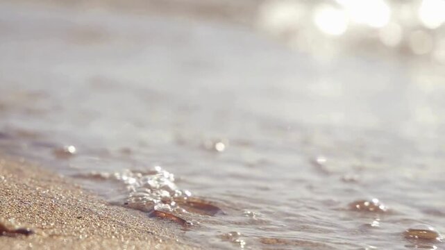 Serene beach, ocean waves, sandy shoreline, water texture