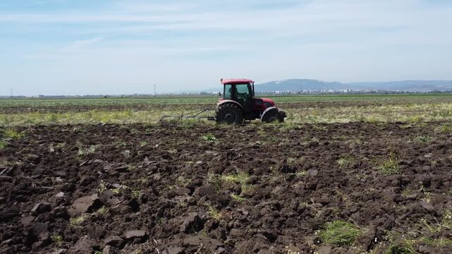 Aerial view of tractor preparing soil for planting