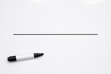 Fototapeta premium A white refrigerator with a black marker drawn on its surface