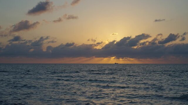 Skyscape with sea horizon. Horizon sunrise sea with ship. Sunrise seascape. Romantic summer vacation seascape. Sea sunset horizon. Sunset cloudy sky. Seascape at summer vacation. Dramatic sky