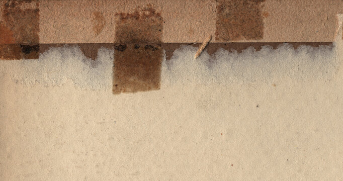 Vintage archival paper texture with aged adhesive residue, tape marks, mounting stains, natural fiber surface and authentic wear.