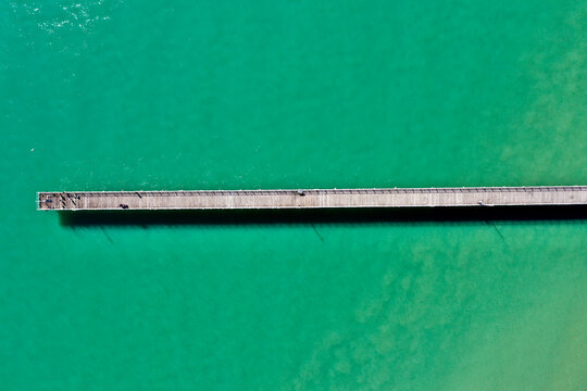 Aerial view of Urangan Pier extending into the turquoise waters, Great Sandy Strait, Queensland, Australia.