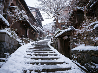 Naklejka premium Snowy Stone Steps in Traditional Japanese Street