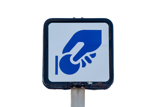 Rusty Spanish parking meter sign with coin payment icon on white background