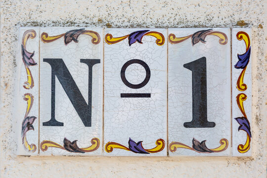 Spanish Ceramic House Number Tile No 1 with Crackle Glaze on White Background
