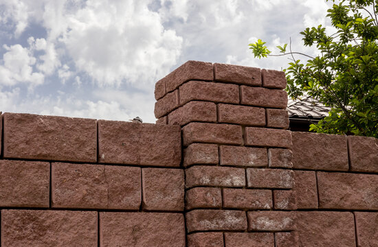 red brick fence with a pillar
