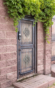 brick fence with a gate for entry into a private, enclosed area
