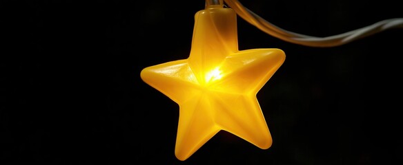 Fototapeta premium A softly illuminated yellow star ornament set against a dark festive backdrop, ideal for holiday themes.