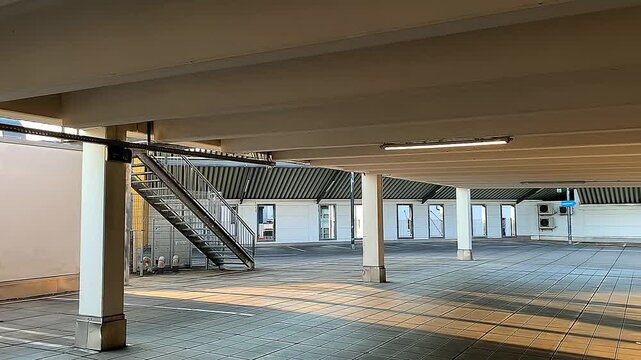 An empty covered parking lot.