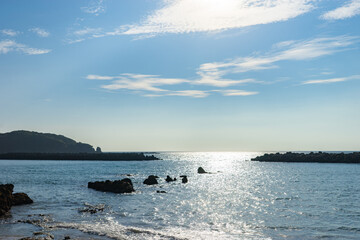Obraz premium Sparkling Sea and Coastal Scenery at Shirahama Beach in Nagasaki, Japan