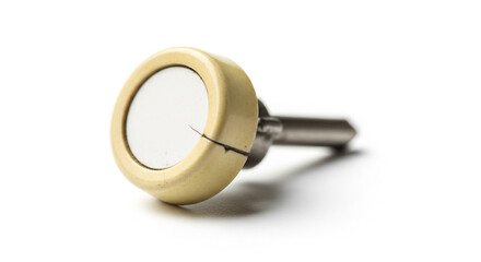 Fototapeta premium Close-up of a beige guitar tuning peg on white background