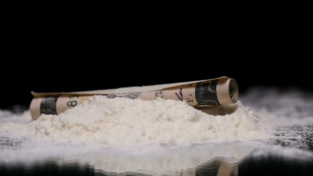Cocaine Drug on Mirror with Rolled Dollar Bill Slow Motion Concept